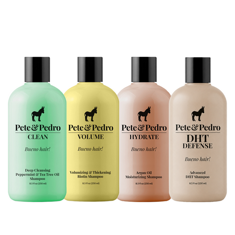 Four bottles of Pete & Pedro dog shampoo lined up against a white background: Clean in mint green, Volume in pale yellow, Hydrate in soft peach, and DHT Defense in light beige. Each bottle has a black cap and a black horse logo on the front.